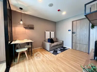 Modern living room with cozy sofa, dining area, and stylish decor in a contemporary apartment.