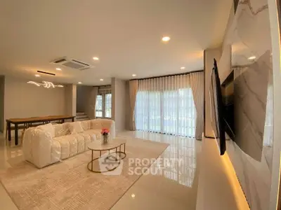 Spacious modern living room with elegant decor and natural light