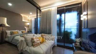 Luxurious modern bedroom with cozy lighting and large windows for natural light.