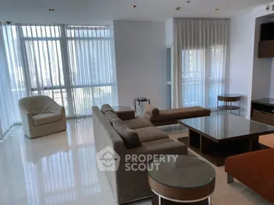 Spacious modern living room with elegant furniture and large windows