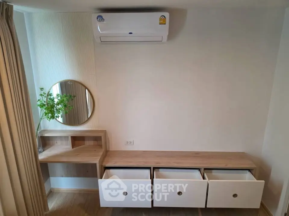 Modern minimalist bedroom with built-in storage and air conditioning