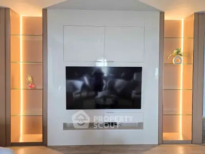 Modern living room with sleek built-in TV unit and ambient lighting