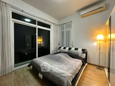 Modern bedroom with stylish bed, large window, and ambient lighting