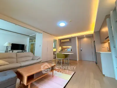 Spacious modern living room with open kitchen and stylish furniture