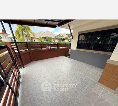 Spacious balcony with tiled flooring and scenic view of residential area