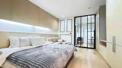 Luxurious modern bedroom with elegant decor and ample natural light