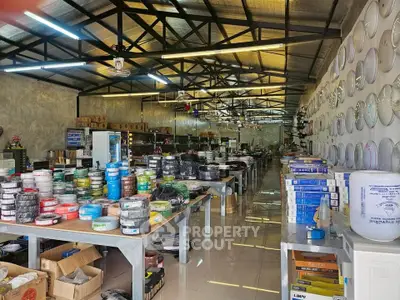 Spacious industrial warehouse with organized shelves and ample storage space