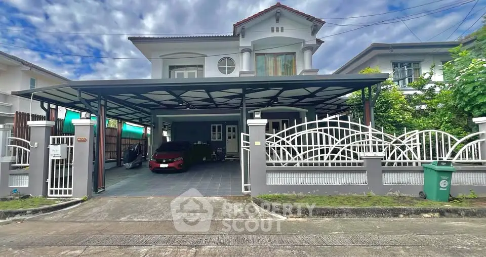 Spacious two-story house with covered parking and modern exterior design.