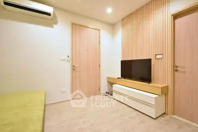 Modern living room with sleek TV unit and wooden accents