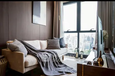 Luxurious living room with city view, modern decor, and cozy ambiance.