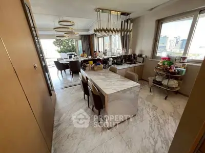 Luxurious open kitchen with marble island and city view