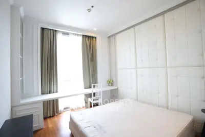 Bright and modern bedroom with large window and elegant decor