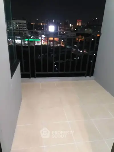 Charming balcony with city night view, perfect for relaxation and enjoying urban scenery.