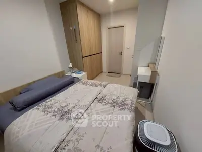 Cozy bedroom with modern decor and ample storage space