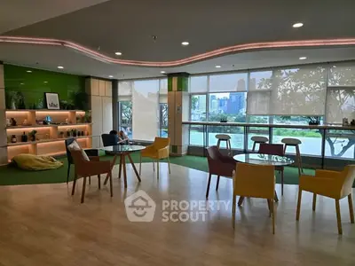 Modern office lounge with city view and stylish furniture