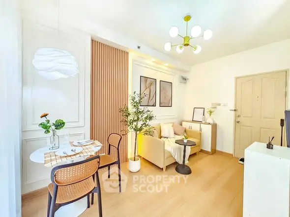 Bright and modern living room with stylish decor and dining area, featuring elegant lighting and cozy seating.