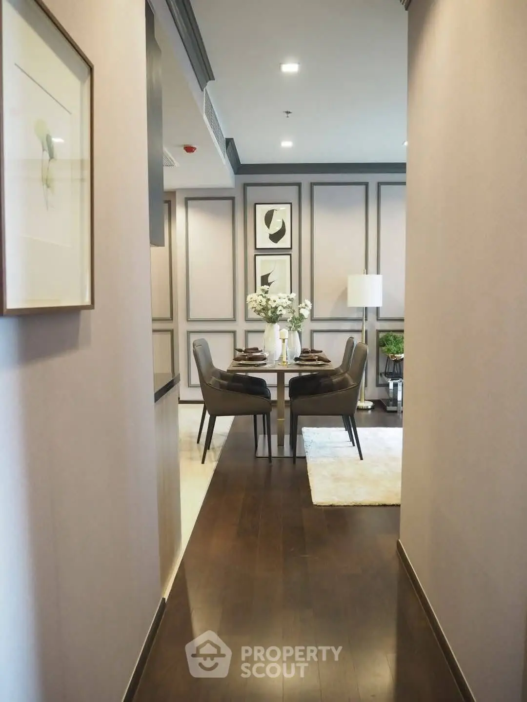 Elegant dining area with modern decor and stylish furniture in a cozy apartment.