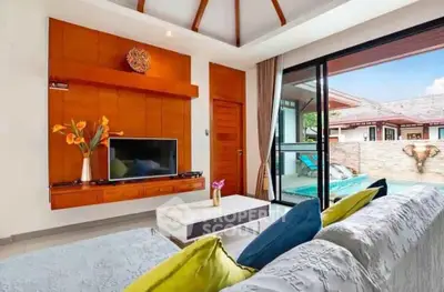 Luxurious living room with pool view and modern decor