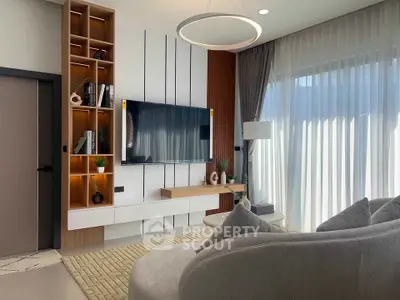 Modern living room with elegant decor and large window for natural light