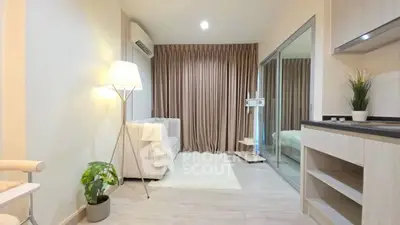 Modern living room with cozy sofa, floor lamp, and stylish decor