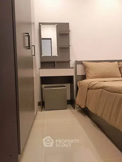 Cozy bedroom with modern furniture and neutral tones, perfect for relaxation and comfort.