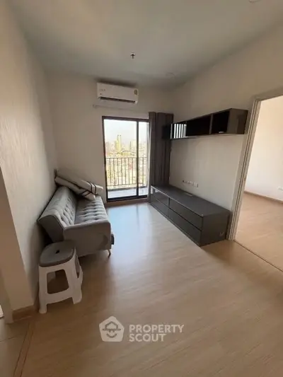 Modern living room with balcony view in urban apartment
