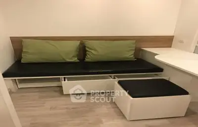 Modern compact living room with sleek furniture and storage solutions