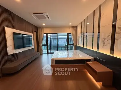 Luxurious modern bedroom with floor-to-ceiling windows and elegant wood paneling.