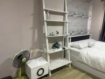 Cozy bedroom with modern shelving and comfortable bed in stylish apartment.