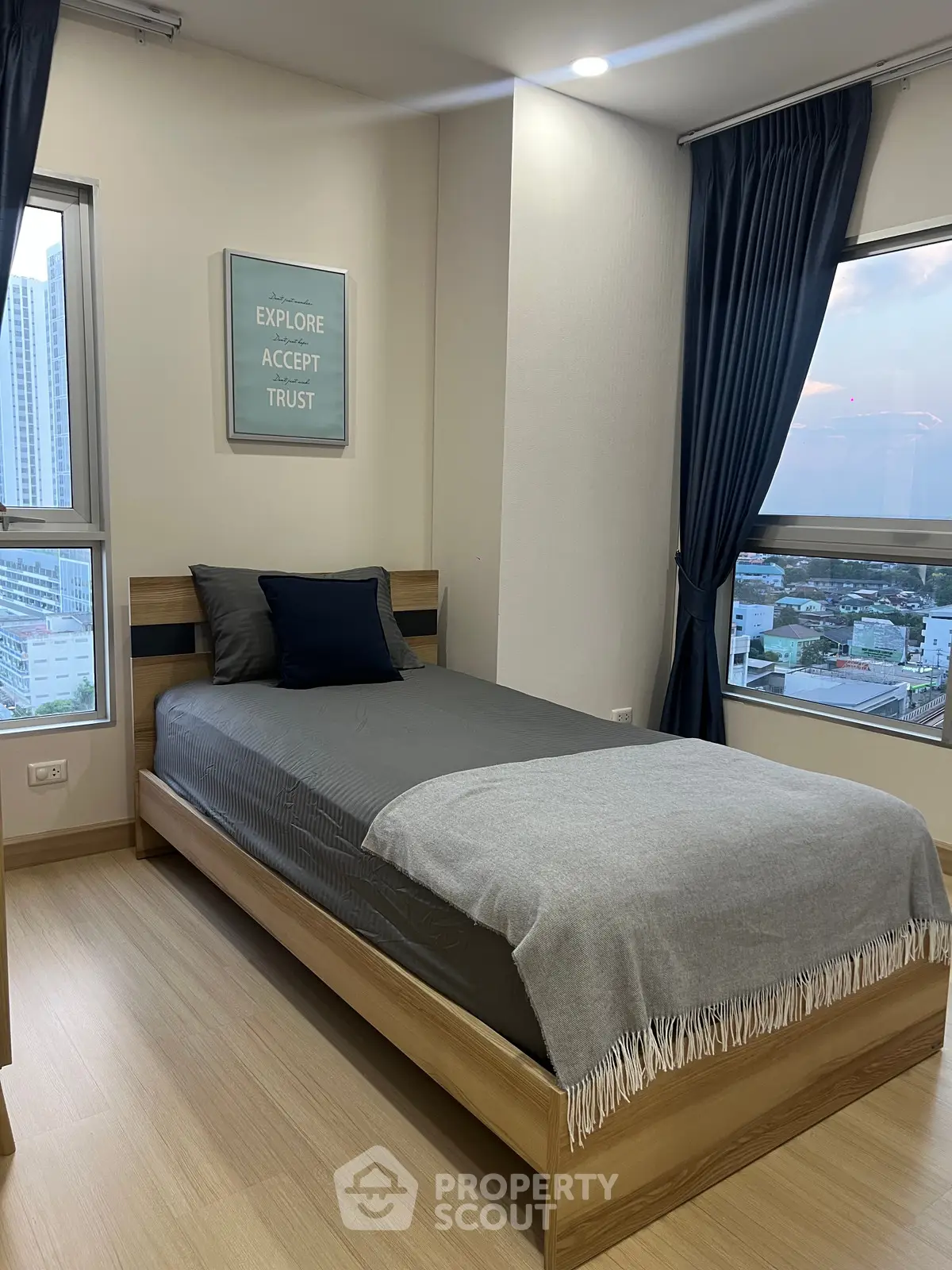 Modern bedroom with city view, featuring sleek design and cozy ambiance, perfect for urban living.