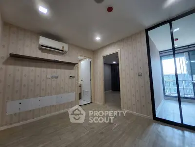 Spacious modern apartment interior with air conditioning and balcony access