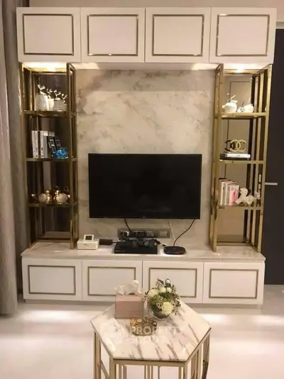 Luxurious living room with elegant TV unit and marble accents, perfect for modern home decor.