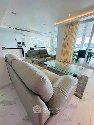Luxurious open-plan living room with modern sofas and stunning views
