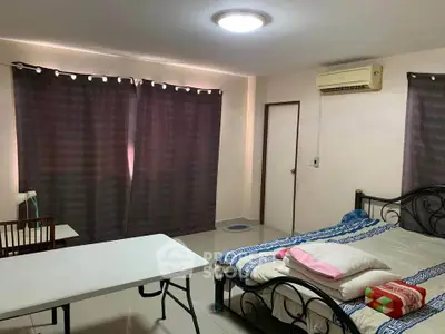 Cozy bedroom with air conditioning and natural light