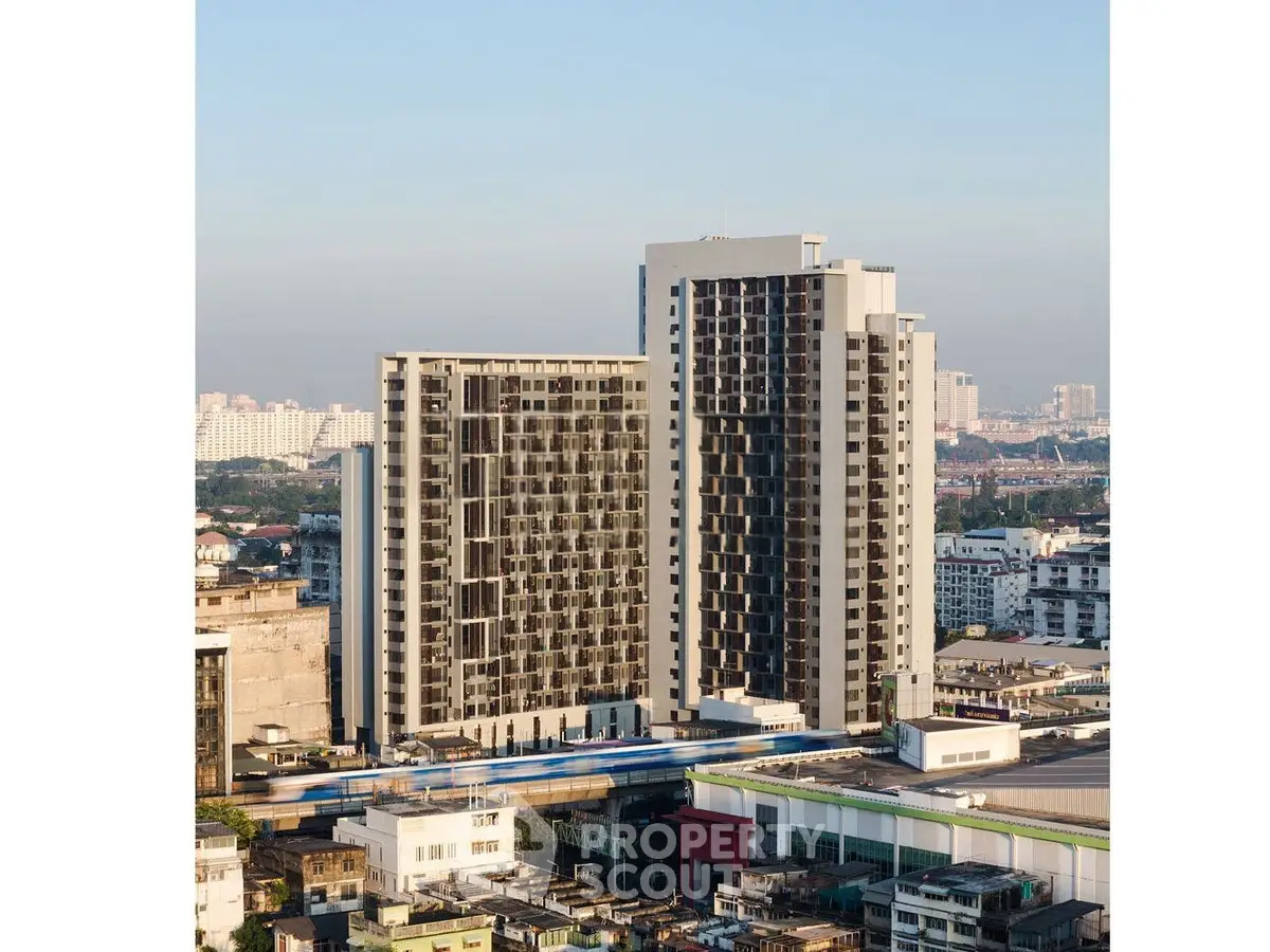 Modern high-rise building with panoramic city views, showcasing urban living at its finest.