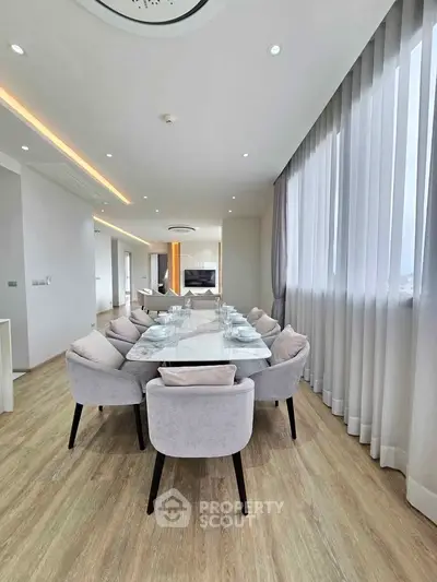 Luxurious modern dining area with elegant decor and natural light