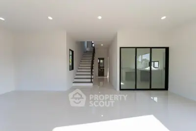Spacious modern interior with sleek staircase and open layout