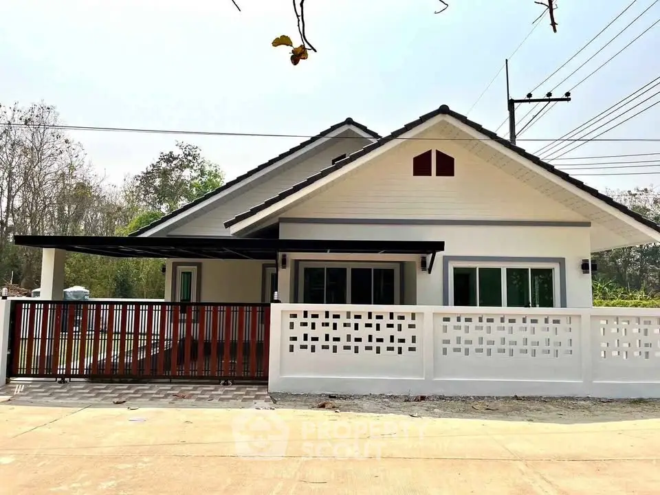 Charming single-story house with modern design and spacious front yard