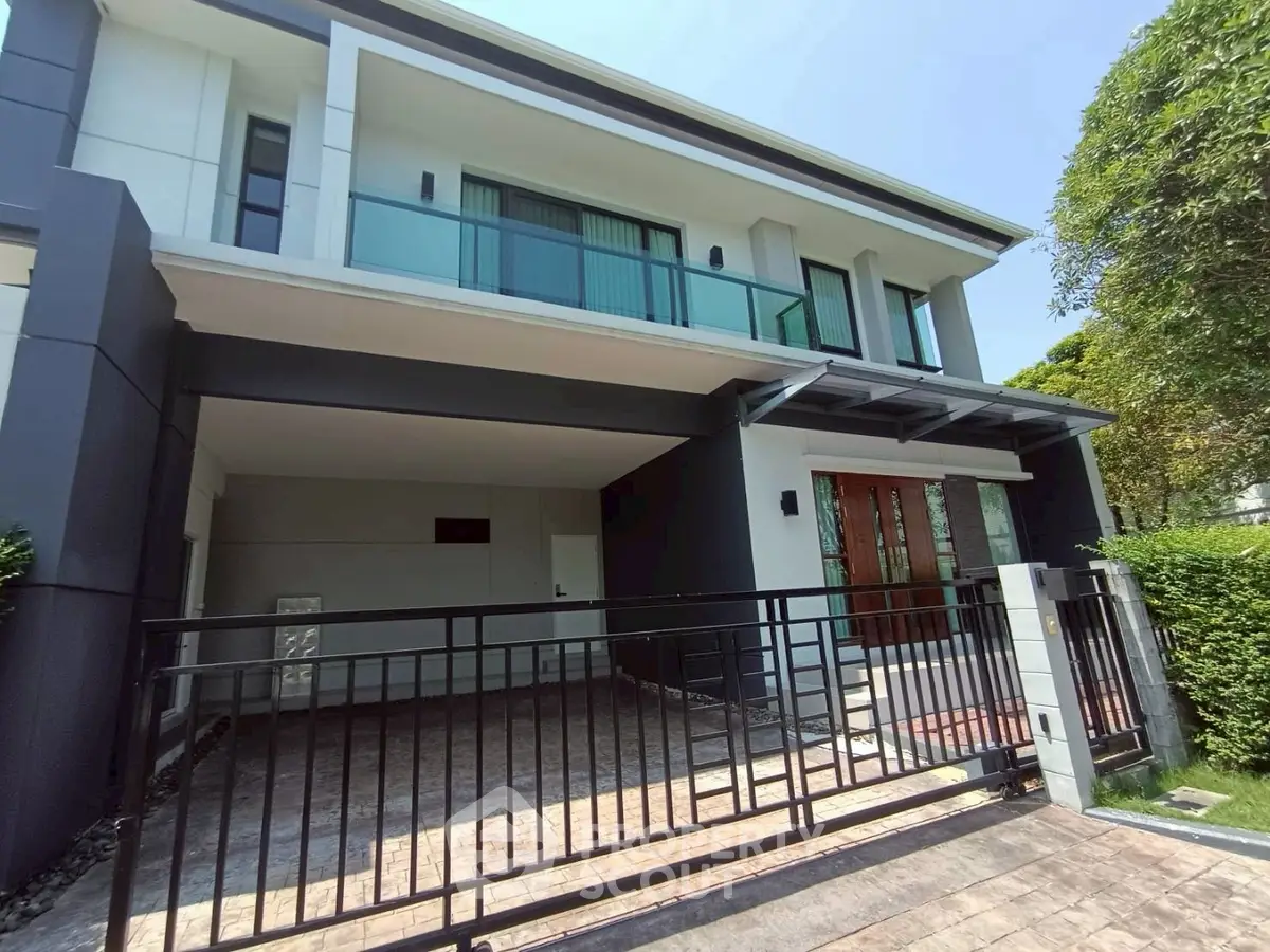 Modern two-story house with sleek design and spacious driveway