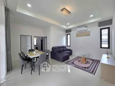 Spacious modern living room with elegant dining area and stylish decor