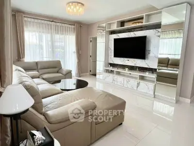 Luxurious living room with elegant marble TV wall and plush leather seating.