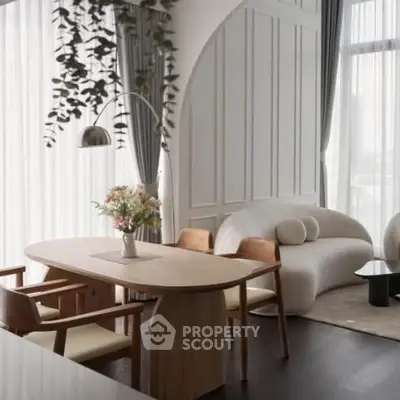 Elegant modern living room with stylish furniture and large windows for natural light.