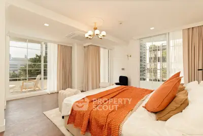 Luxurious bedroom with elegant decor and spacious balcony view