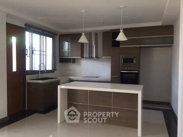 Modern kitchen with sleek cabinetry and island in a contemporary home