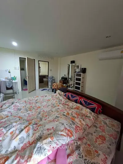 Cozy bedroom with floral bedding and modern decor