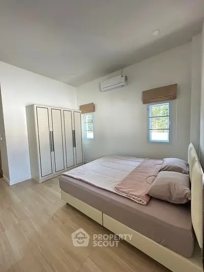 Spacious bedroom with modern design and natural light