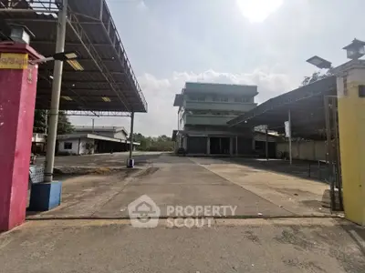 Expansive industrial property with large open area and multiple buildings, ideal for commercial use.