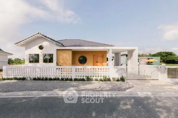 Charming modern house with unique circular windows and stylish facade