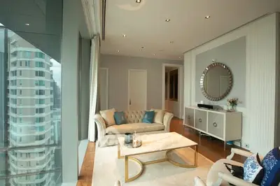 Luxurious living room with elegant decor and stunning city view