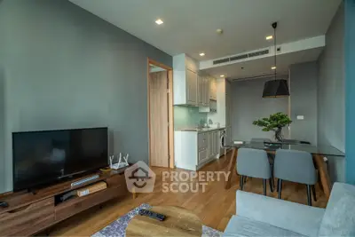 Modern living room with open kitchen and stylish decor